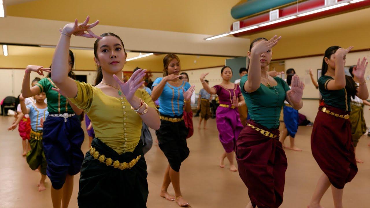 KLACA students practicing Cambodian classical dance hand gestures together in class, wearing traditional tops and skirts